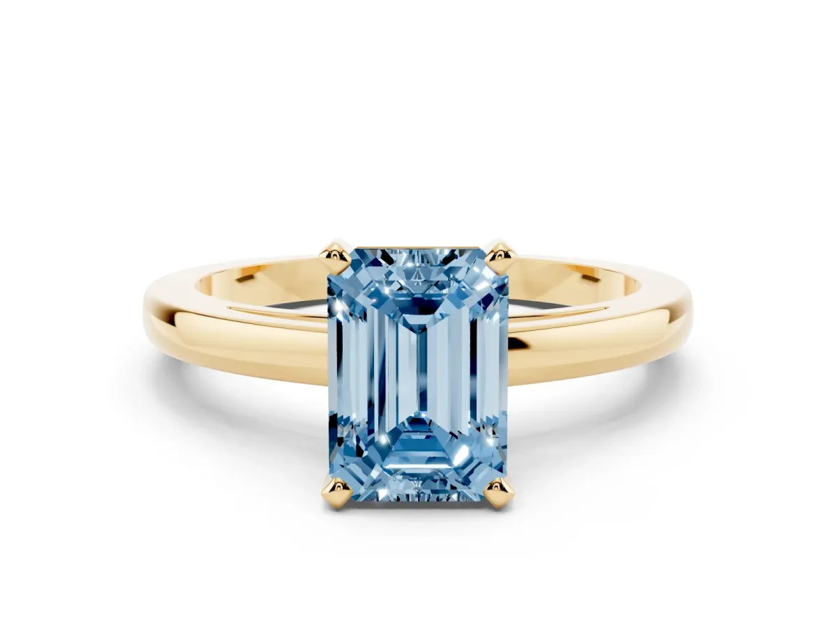 Fancy Blue Emerald Cut Solitaire Diamond Engagement Ring with Four-Prong Setting on a Classic Band Yellow gold