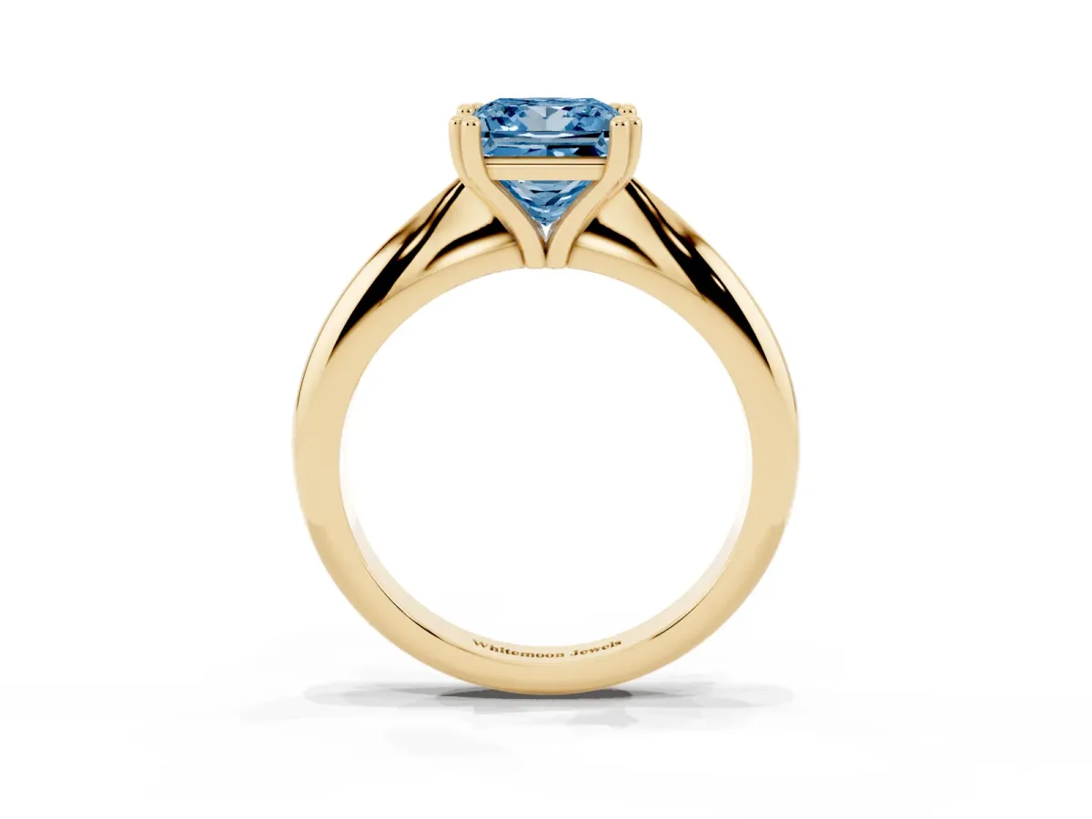 Fancy Blue Princess Cut Cut Solitaire Engagement Ring with Tapered Band and Four-Prong Setting Yellow gold