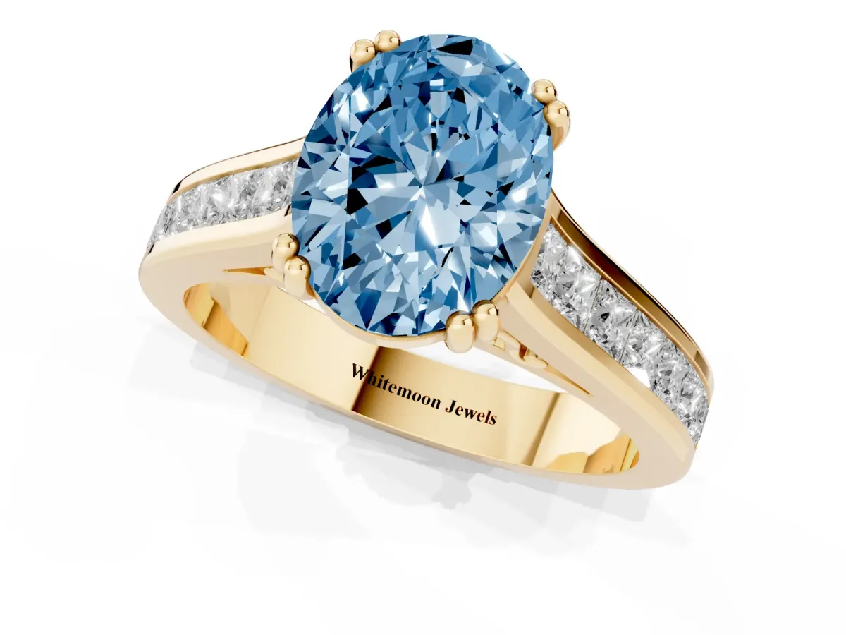 Fancy Blue Oval Cut Cut Channel Set Solitaire Engagement Ring with Prong Setting Yellow gold
