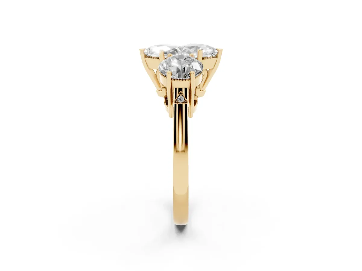 Three-Stone Marquise Cut Diamond Engagement Ring with Prong Setting on a Classic Band Yellow gold