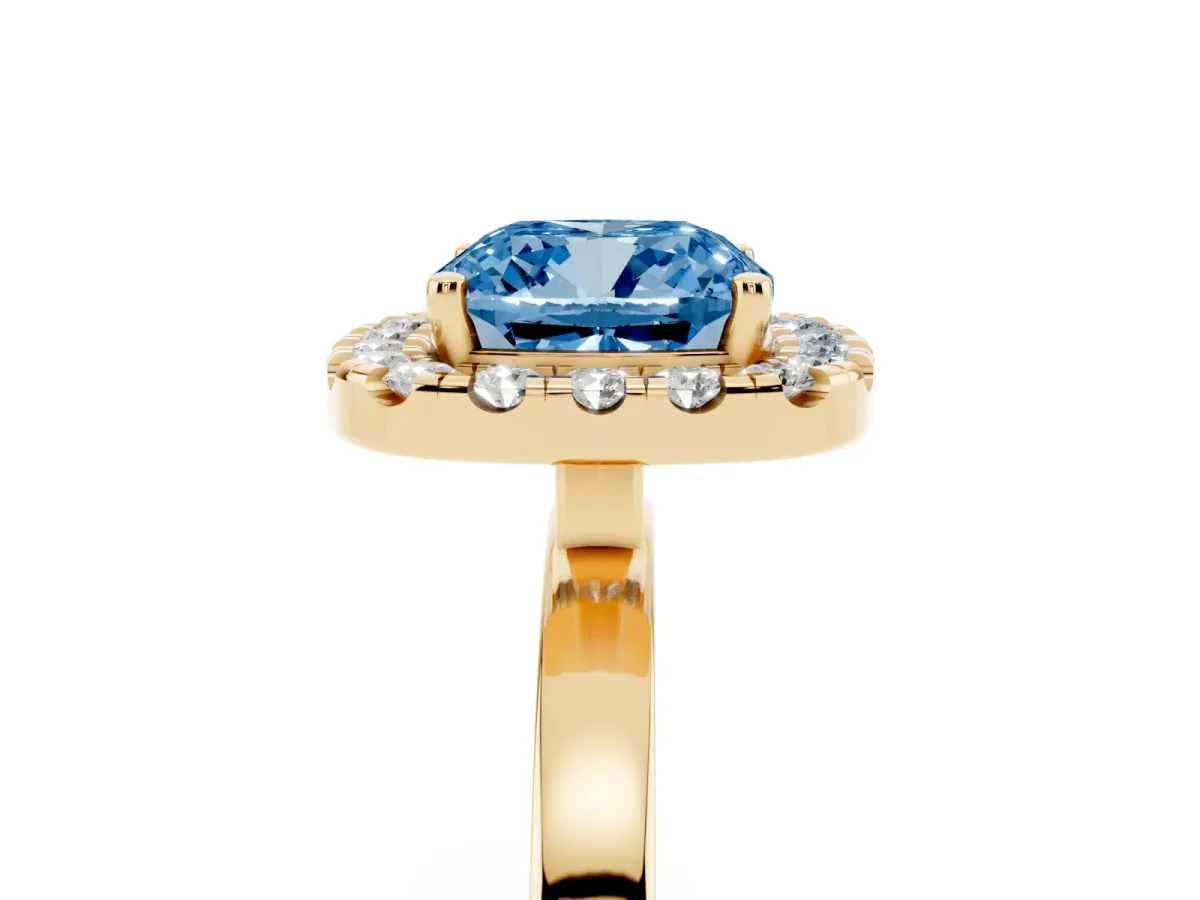 Fancy Blue Cushion Cut Halo Diamond Solitaire with Pavé Band and Four-Prong Setting Yellow gold