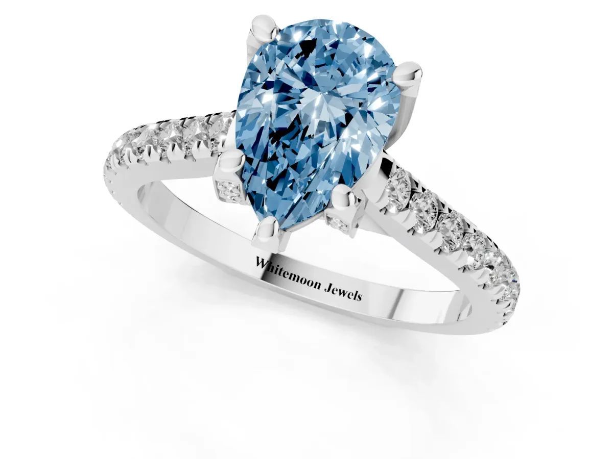 Fancy Blue Pear Cut Brilliant Diamond Solitaire with Pavé Band and Four-Prong Setting Silver