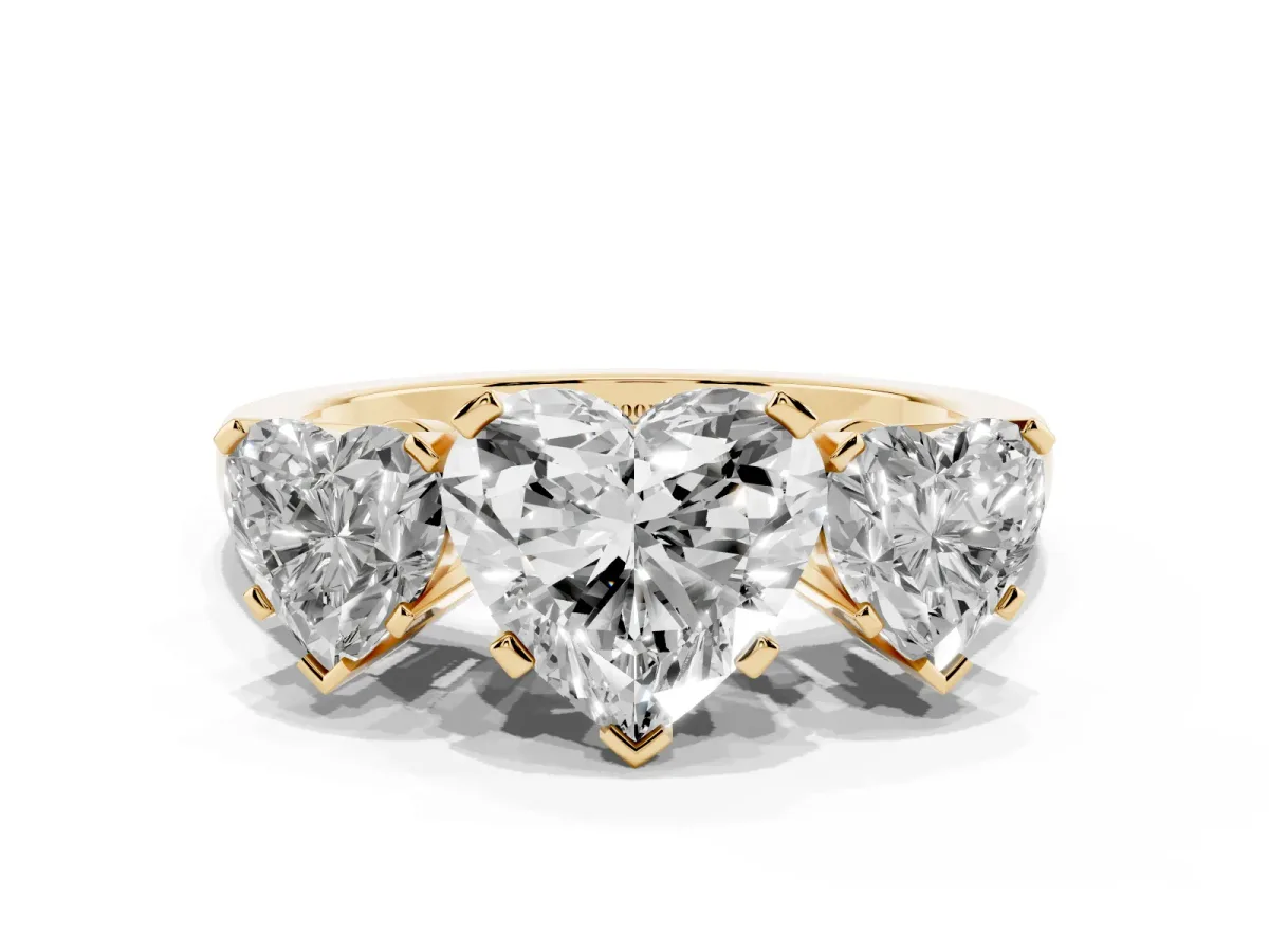 Three-Stone Heart Cut Cut Diamond Ring with Channel Set Band and Four-Prong Setting Yellow gold