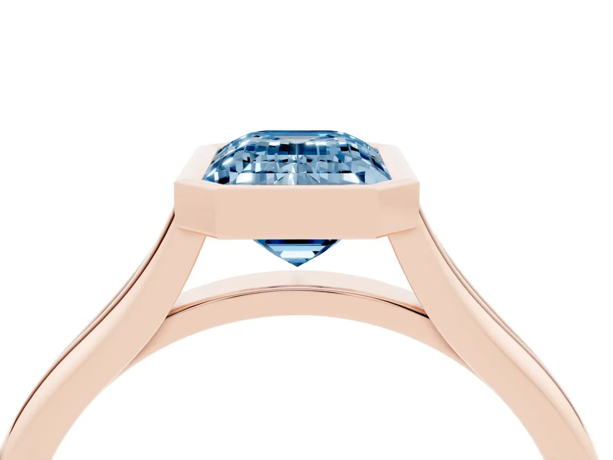 Fancy Blue Bezel Set Emerald Cut Cut Solitaire Ring with Tapered Band Rose gold
