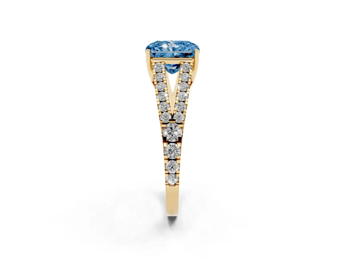 Fancy Blue Radiant Cut Diamond Split Shank Engagement Ring with Round Pavé and Prong Setting Yellow gold