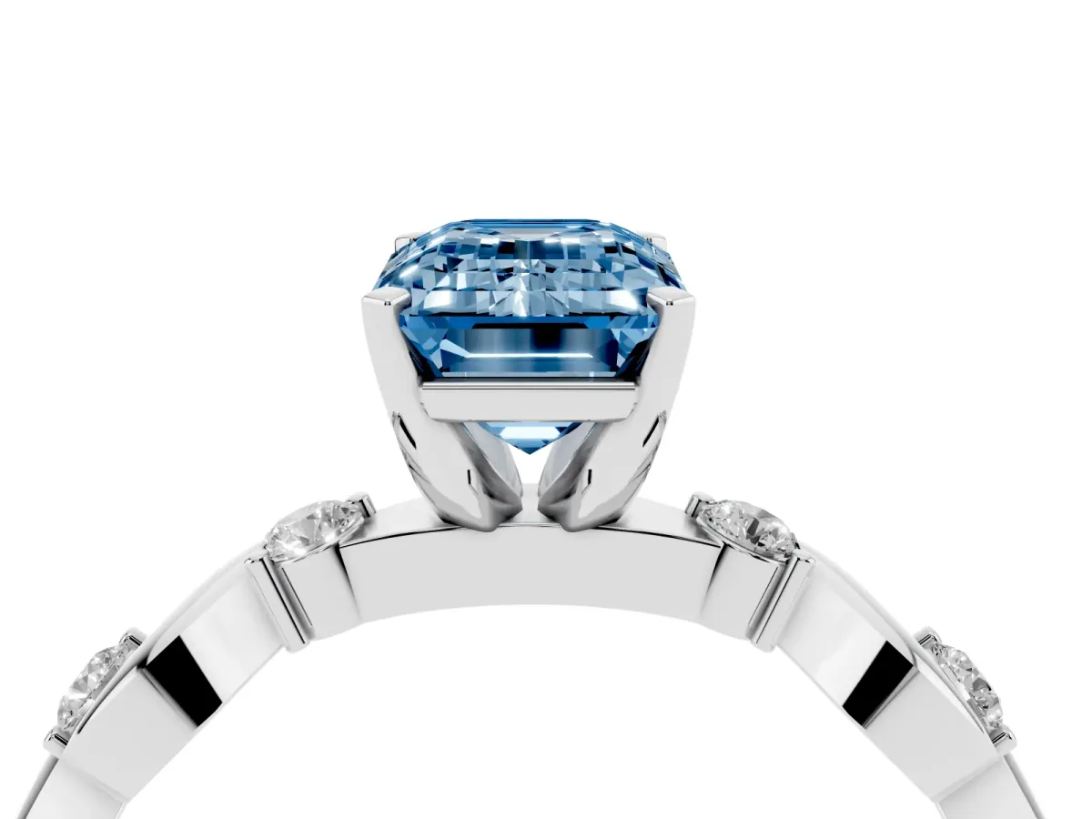 Fancy Blue Emerald Cut Diamond Solitaire Twisted Band with Round Accents and Prong Setting Platinum