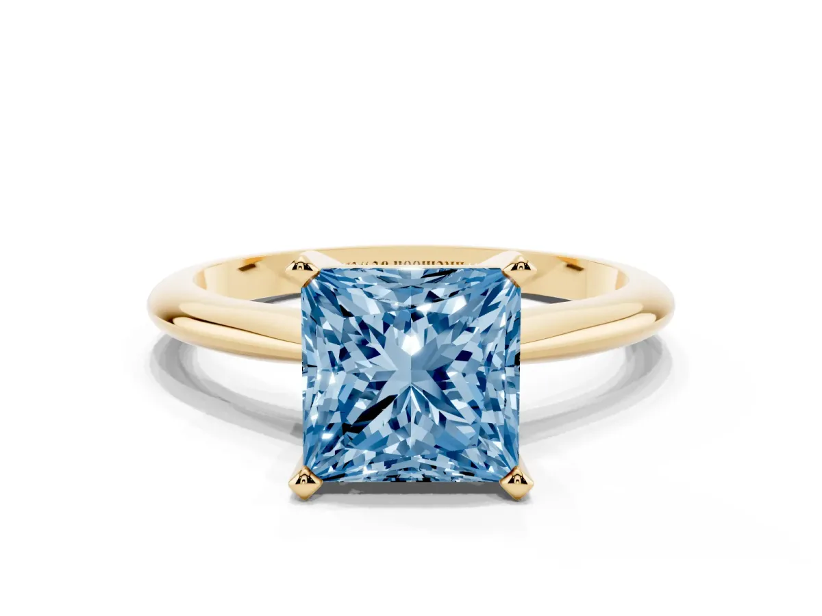 Fancy Blue Princess Cut Cut Solitaire Ring with Four-Prong Setting on a Classic Band Yellow gold
