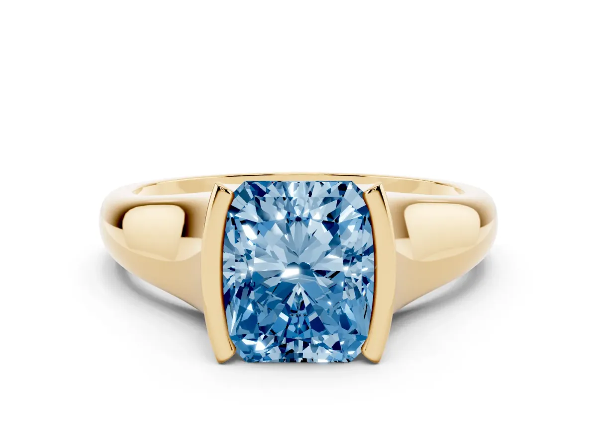 Fancy Blue Radiant Cut Solitaire Tension Set Diamond Ring with Split Shank Band Yellow gold