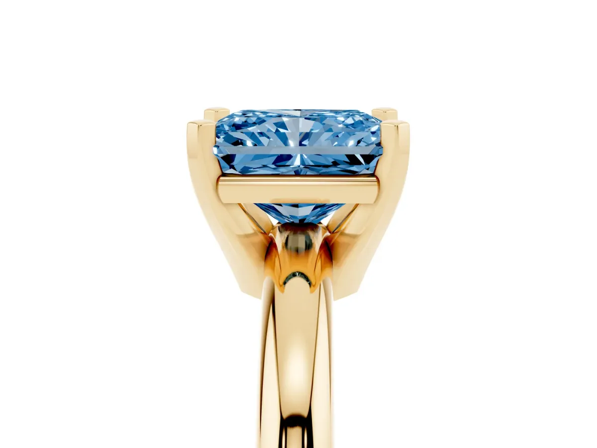 Fancy Blue Radiant Cut Diamond Solitaire Engagement Ring with Round Band and Four-Prong Setting Yellow gold