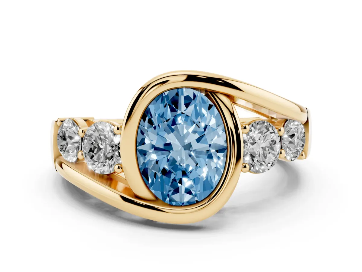 Fancy Blue Bezel Set Oval Cut Diamond Bypass Ring with Round Accents Yellow gold