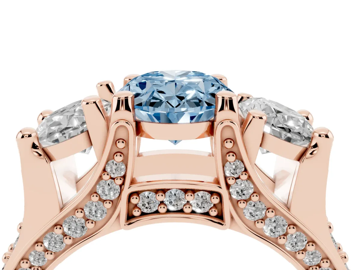 Fancy Blue Oval Cut Diamond Three-Stone Ring with Channel Set Band and Four-Prong Setting Rose gold