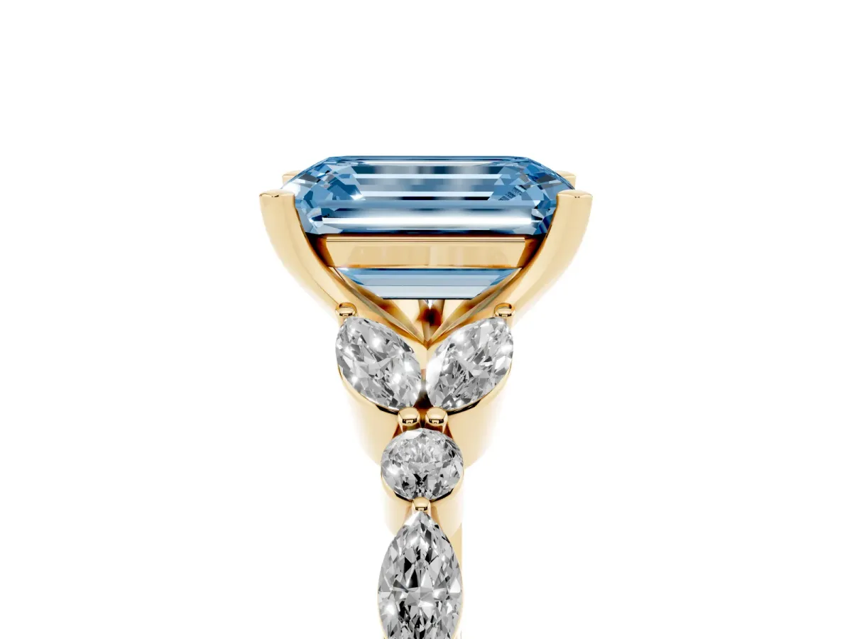 Fancy Blue Emerald Cut Diamond Solitaire Ring with Side Stones and Four-Prong Setting Yellow gold
