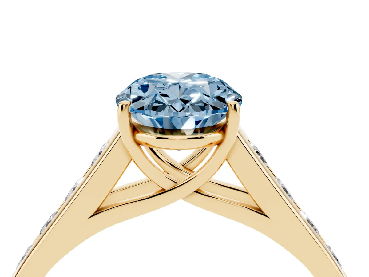 Fancy Blue Oval Cut Brilliant Channel-Set Solitaire Ring with Four-Prong Setting Yellow gold
