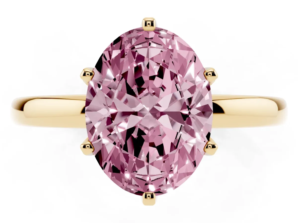Fancy Pink Oval Cut Solitaire Diamond Ring with Six-Prong Setting on a Classic Band Yellow gold