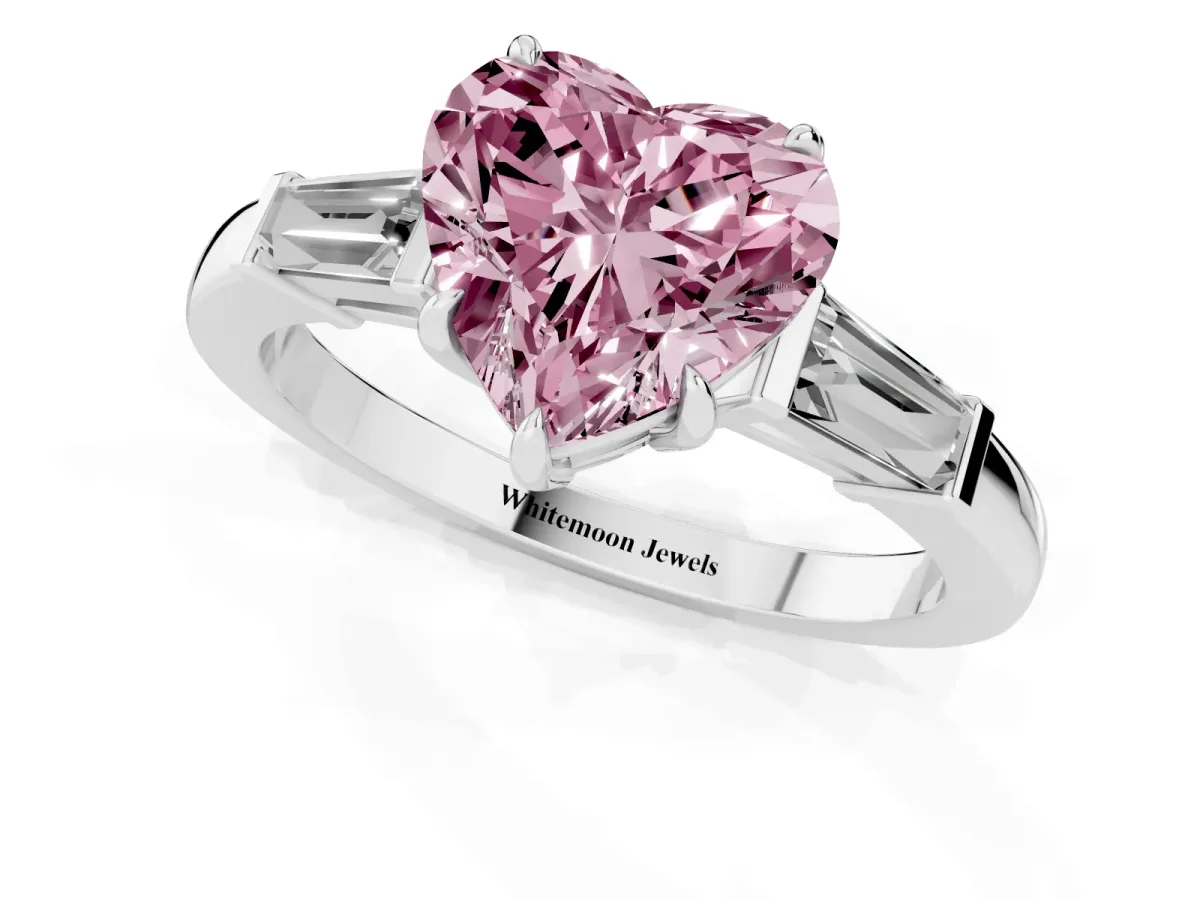 Fancy Pink Heart Cut Diamond Three-Stone Ring with Tapered Baguette Side Stones and Prong Setting Platinum