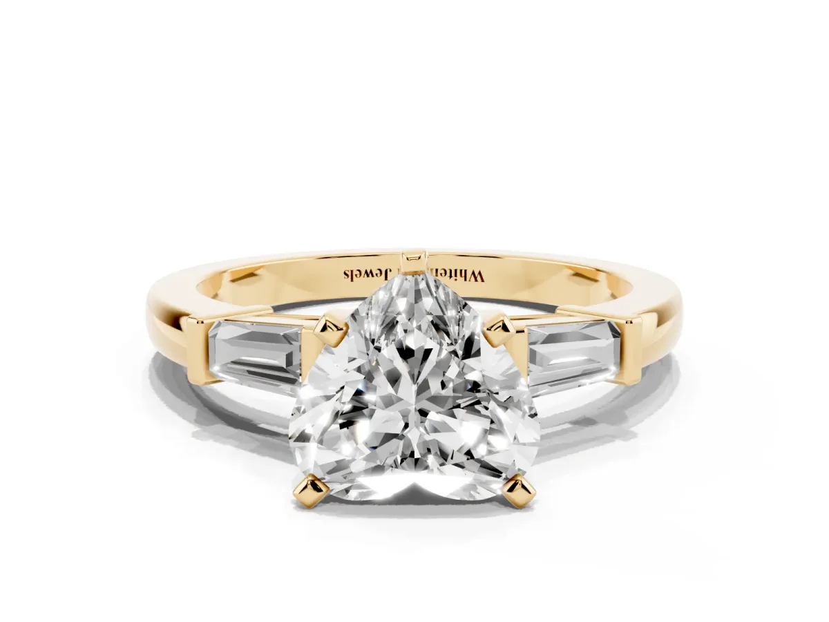 Heart Cut Cut Diamond Solitaire Ring with Tapered Baguette Accents and Four-Prong Setting Yellow gold