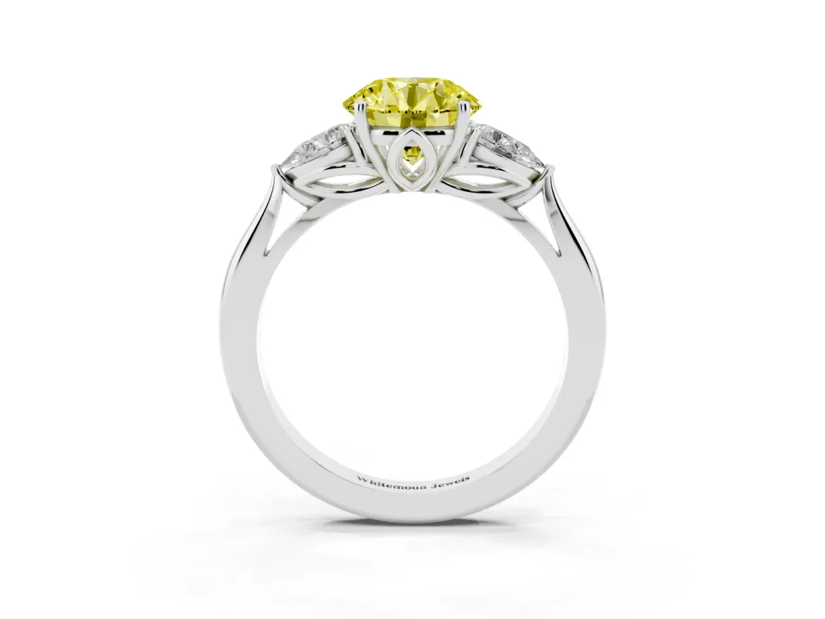 Fancy Yellow Three-Stone Round Cut Diamond Ring with Pear Side Stones in Four-Prong Setting Platinum