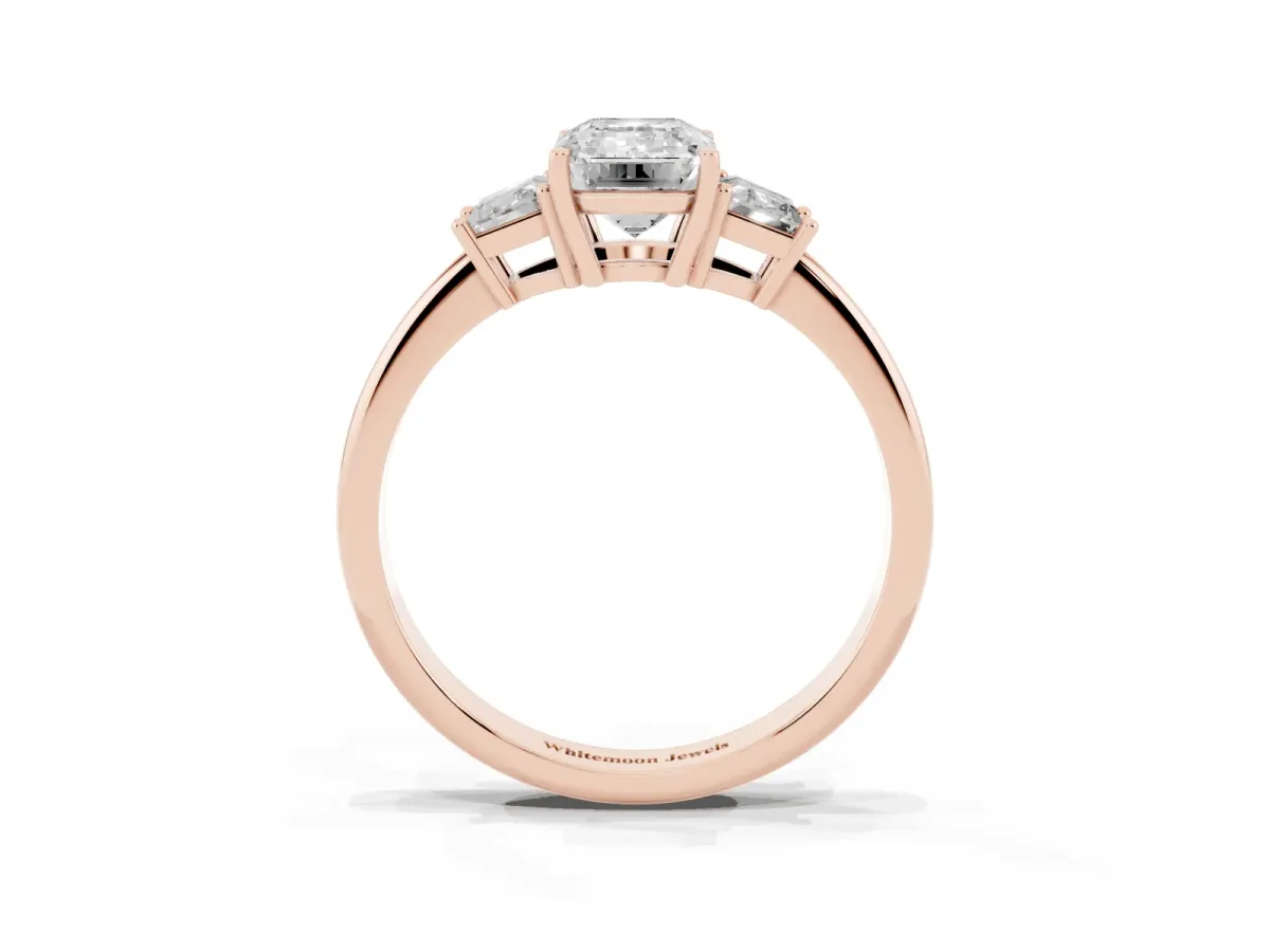 Emerald Cut Diamond Three-Stone Ring with Trapezoid Side Stones and Prong Setting Rose gold