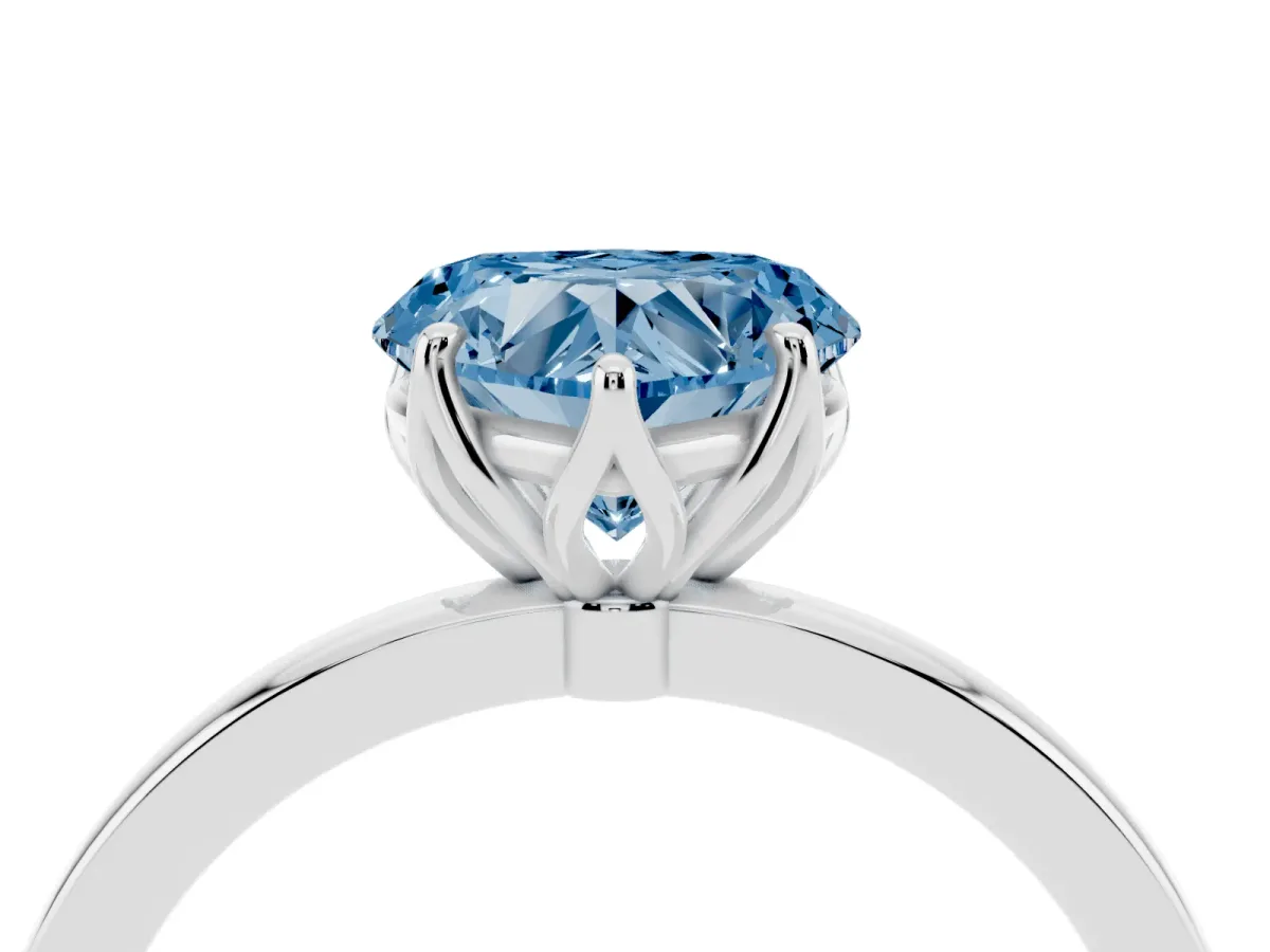 Fancy Blue Heart Cut Diamond Solitaire Ring with Thin Band and Prong Setting Silver