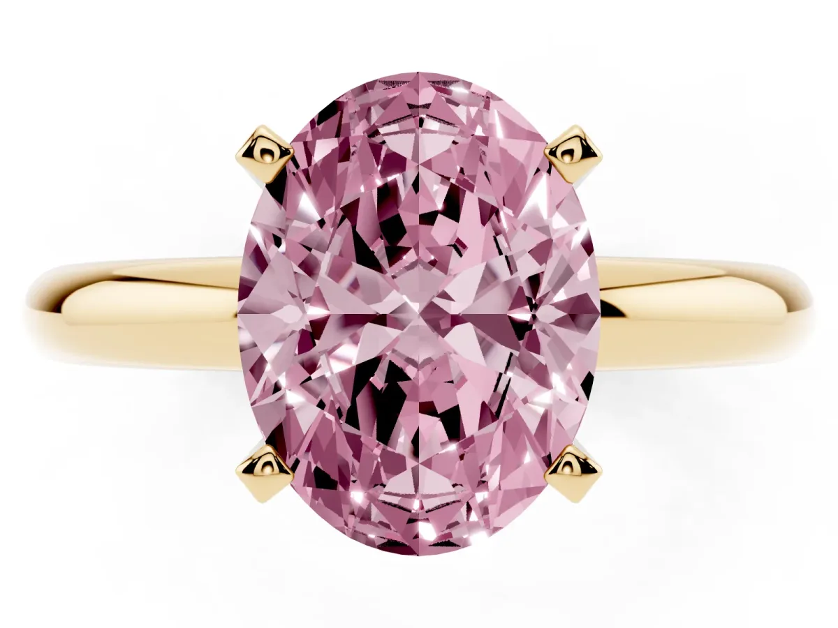 Fancy Pink Oval Cut Diamond Solitaire Engagement Ring with Round Band and Four-Prong Setting Yellow gold