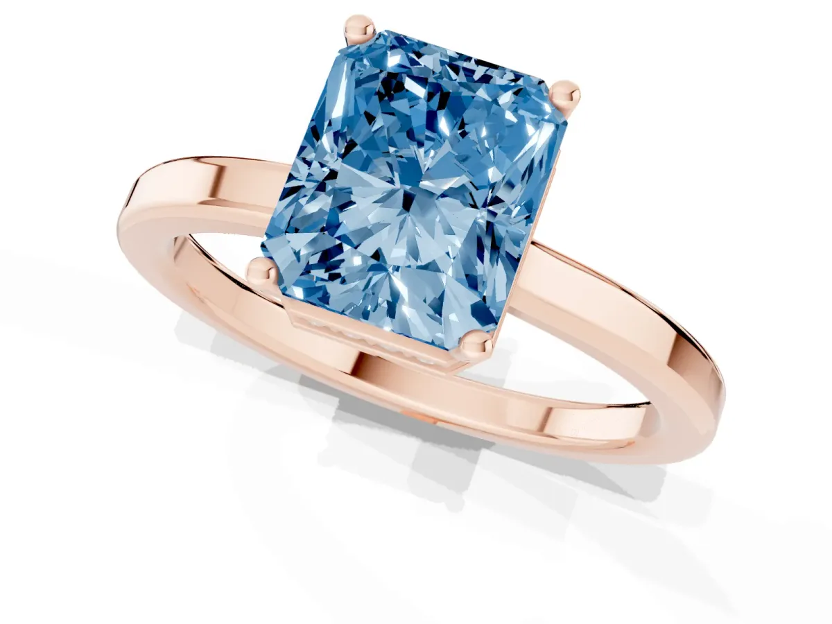 Fancy Blue Radiant Cut Cut Solitaire Engagement Ring with Four-Prong Setting on a Classic Band Rose gold