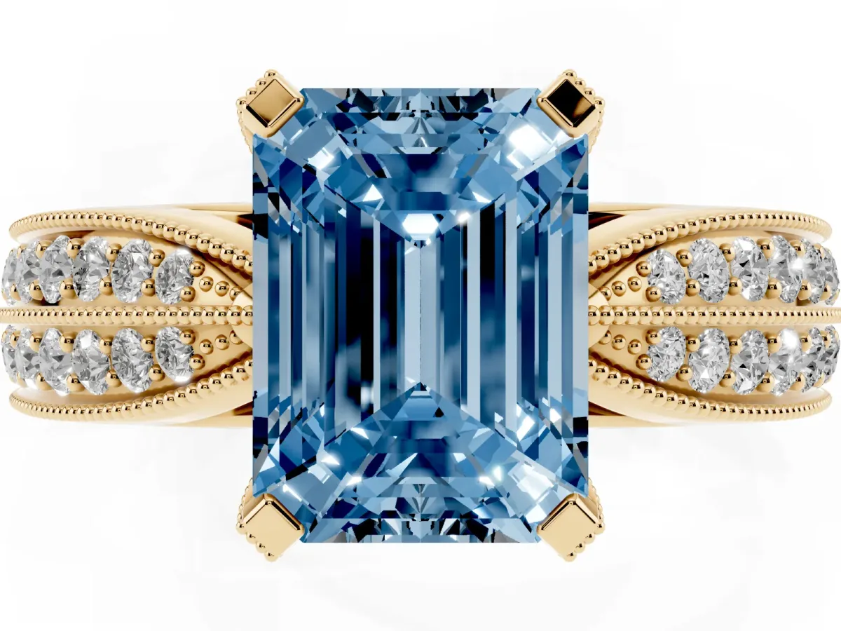 Fancy Blue Emerald Cut Diamond Solitaire Ring with Milgrain Round Pavé Band and Prong Setting Yellow gold