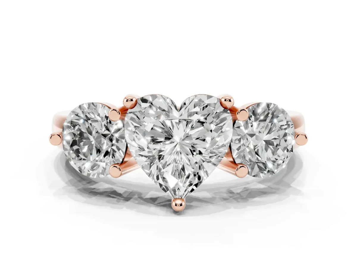 Three-Stone Heart Cut Brilliant Cut Solitaire Ring with Prong Setting on a Classic Band Rose gold