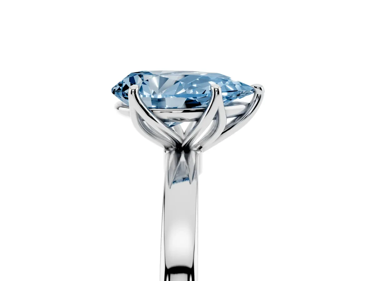Fancy Blue Pear Cut Diamond Solitaire Ring with Thin Band and Prong Setting Silver
