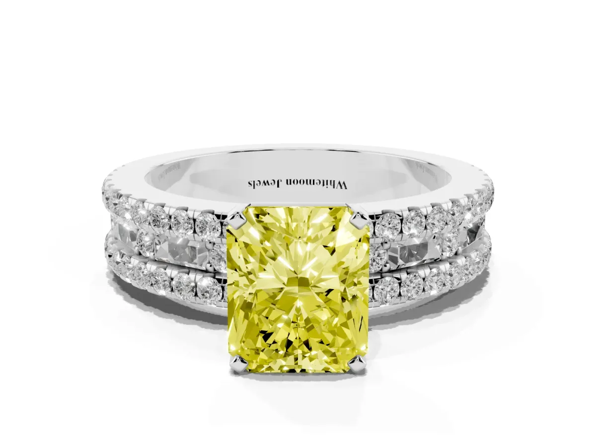 Fancy Yellow Radiant Cut Diamond Solitaire Ring with Pavé and Channel Set Band Platinum