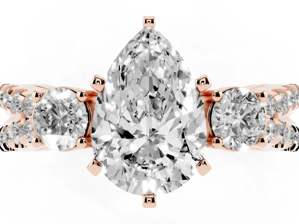 Pear Cut Diamond Three-Stone Ring with Pavé Split Shank and Four-Prong Setting Rose gold