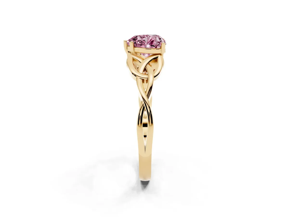 Fancy Pink Heart Cut Diamond Solitaire Engagement Ring with Celtic Knot Band and Four-Prong Setting Yellow gold