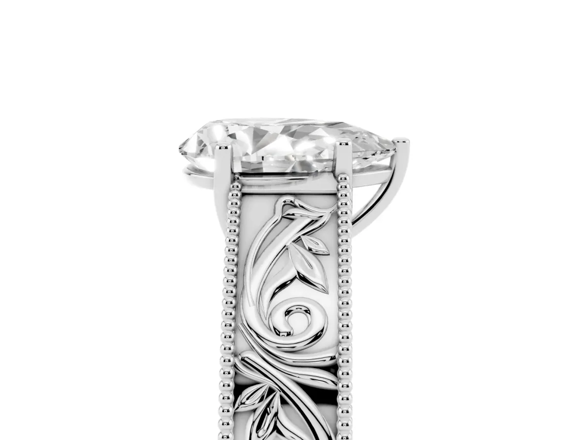 Pear Cut Diamond Solitaire Ring with Engraved Band and Four-Prong Setting Silver