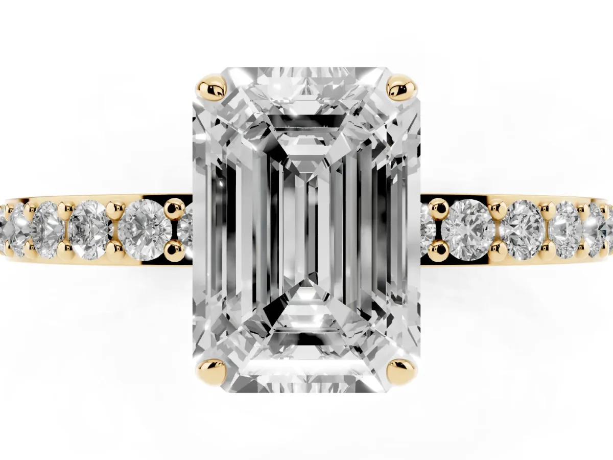 Emerald Cut Diamond Solitaire Engagement Ring with Pavé Band and Four-Prong Setting Yellow gold