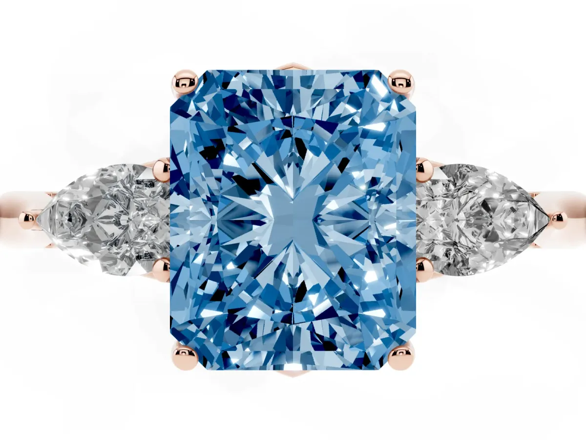 Fancy Blue Radiant Cut Diamond Three-Stone Ring with Pear Side Stones and Prong Setting Rose gold