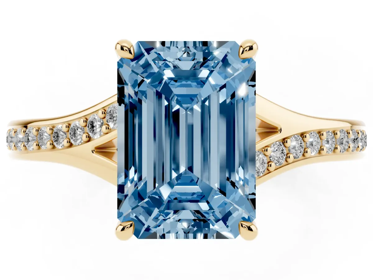 Fancy Blue Emerald Cut Diamond Solitaire Ring with Pavé Band and Prong Setting Yellow gold