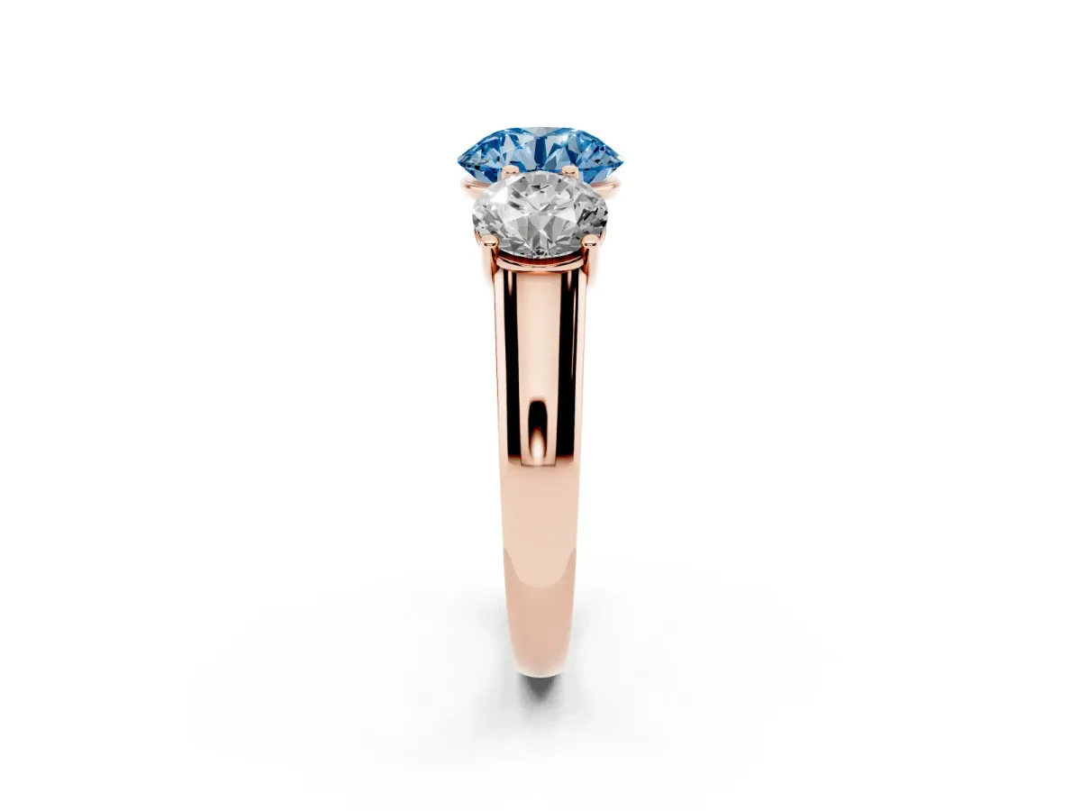 Fancy Blue Round Cut Three-Stone Diamond Ring with Prong Setting on a Classic Band Rose gold