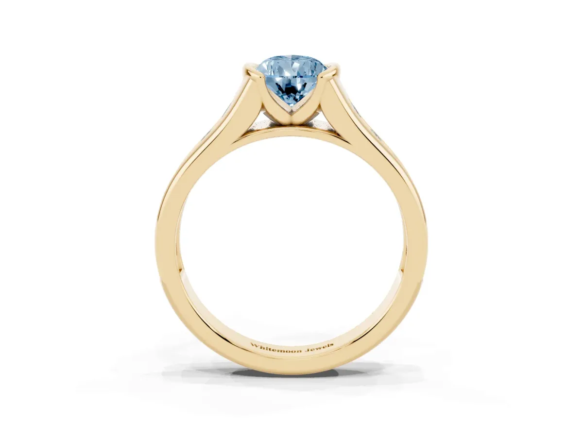 Fancy Blue Pear Cut Solitaire Bezel-Set Diamond Ring with Channel-Set Band Yellow gold