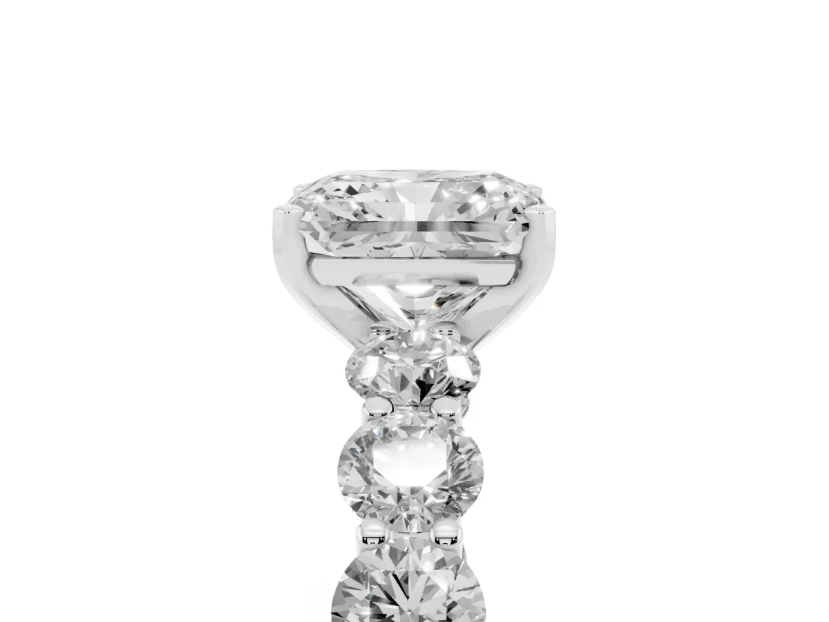 Radiant Cut Diamond Prong Setting with Side Stones on a Pave Band Silver