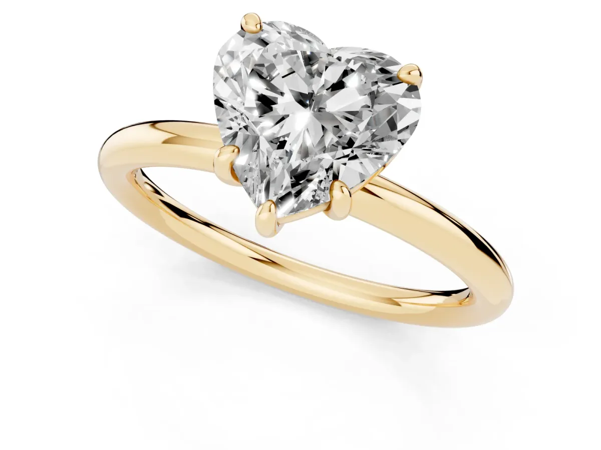 Heart Cut Solitaire Diamond Ring with Four-Prong Setting on a Plain Band Yellow gold