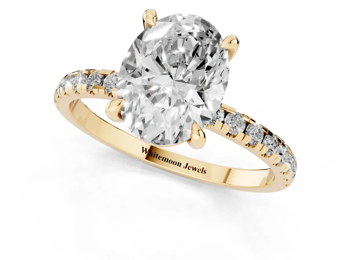 Oval Cut Diamond Brilliant Solitaire Ring with Pavé Band and Four-Prong Setting Yellow gold