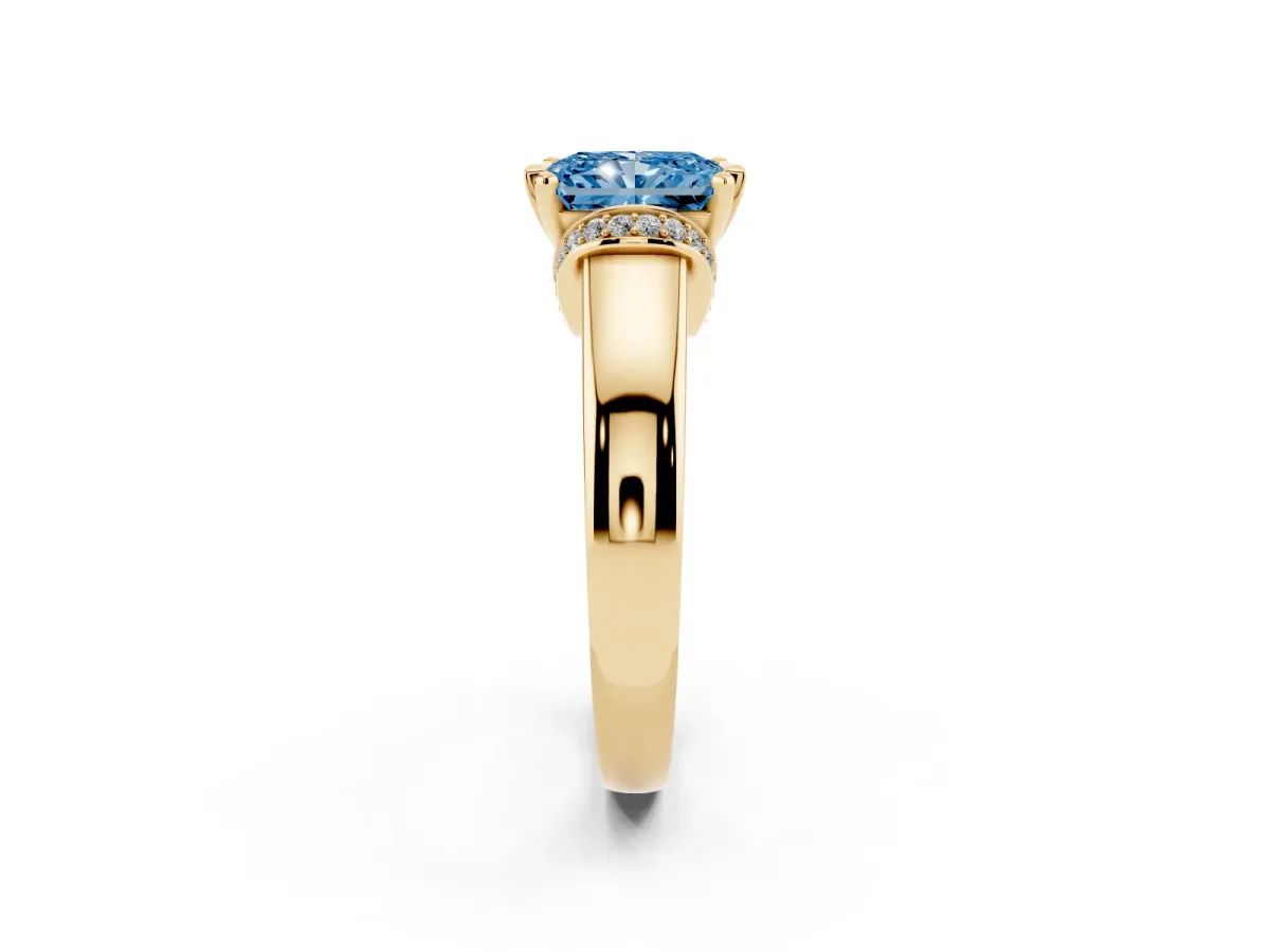 Fancy Blue Radiant Cut Solitaire Diamond Ring with Pave Band and Six-Prong Setting Yellow gold