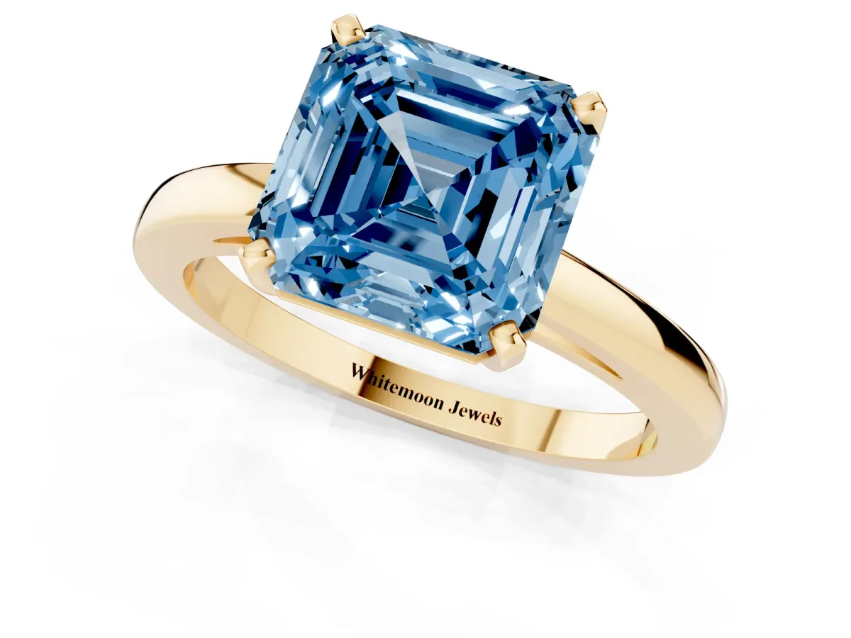 Fancy Blue Asscher Cut Solitaire Diamond Engagement Ring with Four-Prong Setting on a Classic Band Yellow gold