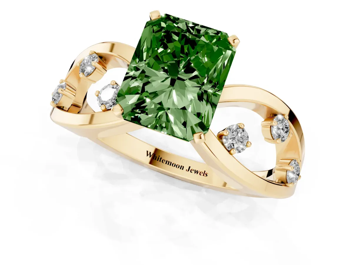 Fancy Green Radiant Cut Cut Solitaire Diamond with Side Stones on Criss-Cross Band and Four-Prong Setting Yellow gold