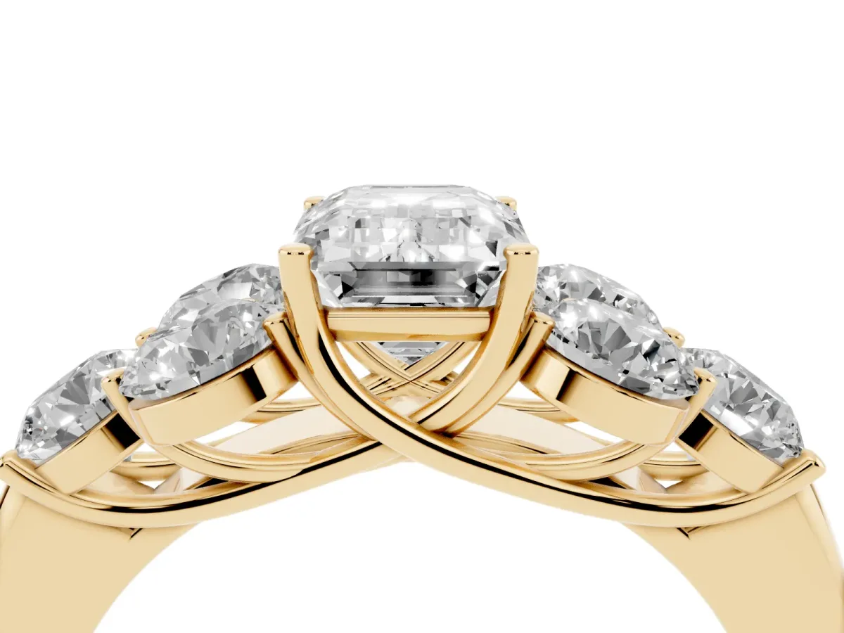 Emerald Cut Cut Diamond Cluster Ring with Round Accent Stones and Prong Setting on a Classic Band Yellow gold