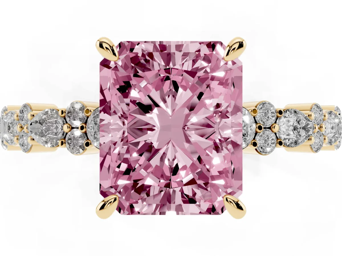 Fancy Pink Radiant Cut Diamond Side Stone Solitaire Ring with Round and Four-Prong Setting Yellow gold