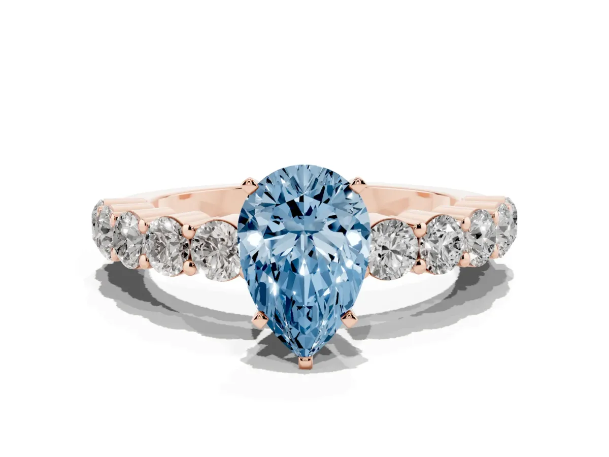 Fancy Blue Pear Cut Diamond Solitaire Ring with Shared Prong Round Side Stones Rose gold