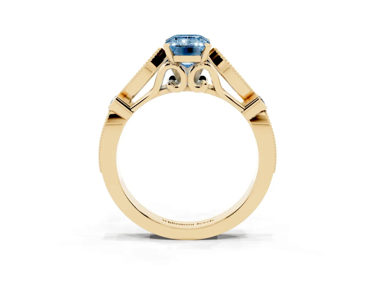 Fancy Blue Emerald Cut Cut Diamond with Milgrain Marquise and Bezel Accents on a Solitaire Band with Prong Setting Yellow gold