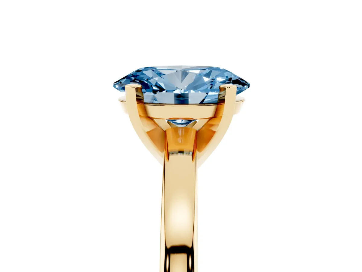 Fancy Blue Oval Cut Solitaire Diamond Engagement Ring with Four-Prong Setting on a Classic Band Yellow gold