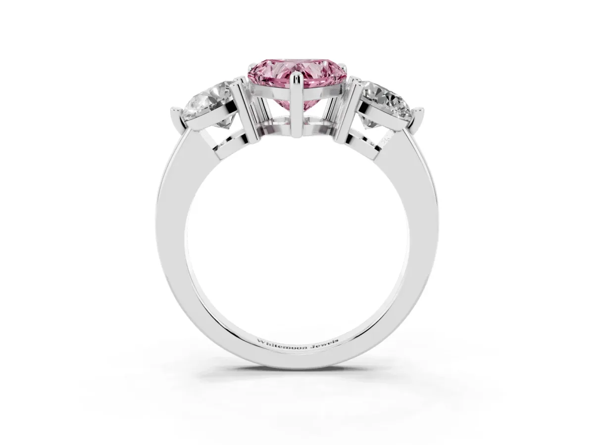 Fancy Pink Three-Stone Heart Cut Brilliant Cut Solitaire Ring with Prong Setting on a Classic Band White gold