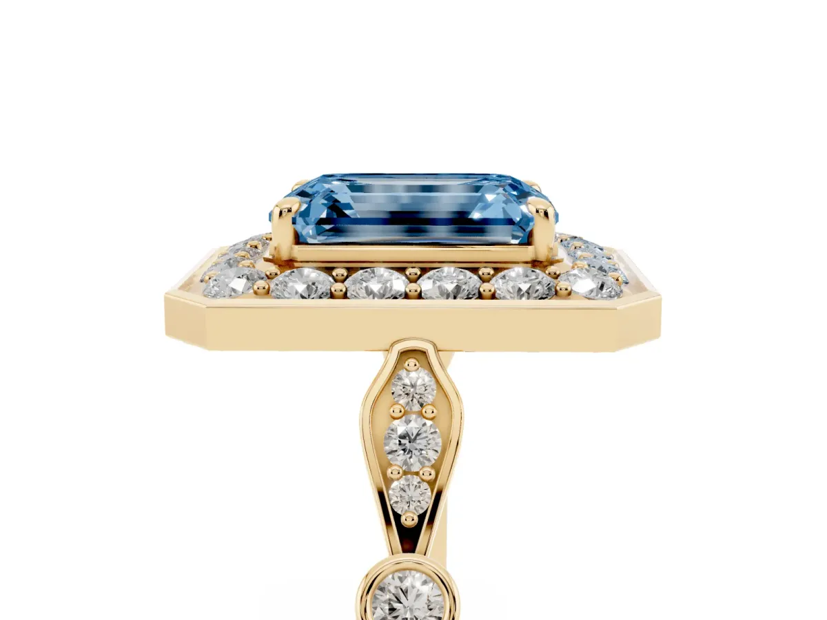 Fancy Blue Emerald Cut Halo Diamond Engagement Ring with Twisted Band and Four-Prong Setting Yellow gold